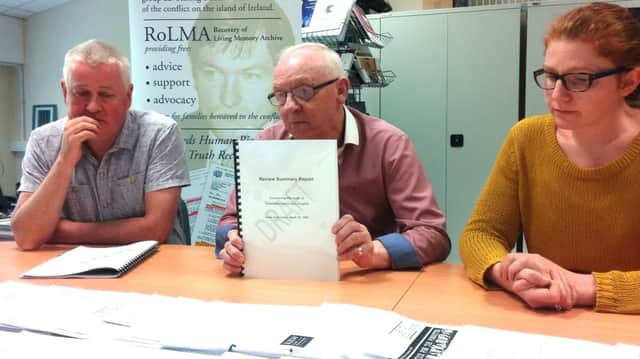 Mickey English pictured with the newly-released review into his son's death. On left is Paul O'Connor and, on right, Sara Duddy, PFC.