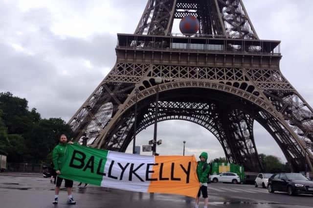 Seamus and Sean with the flag outside Stade de France in Paris.