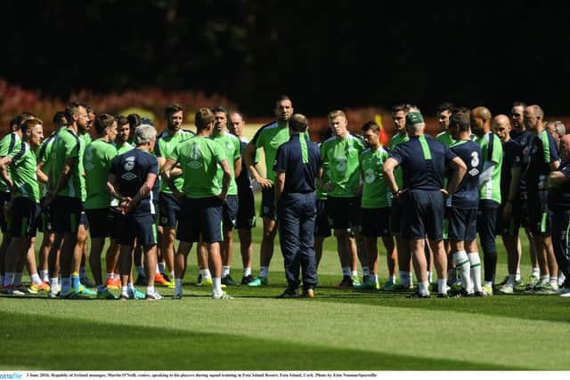Republic of Ireland manager, Martin O'Neill, centre, speaking to his players during squad training.