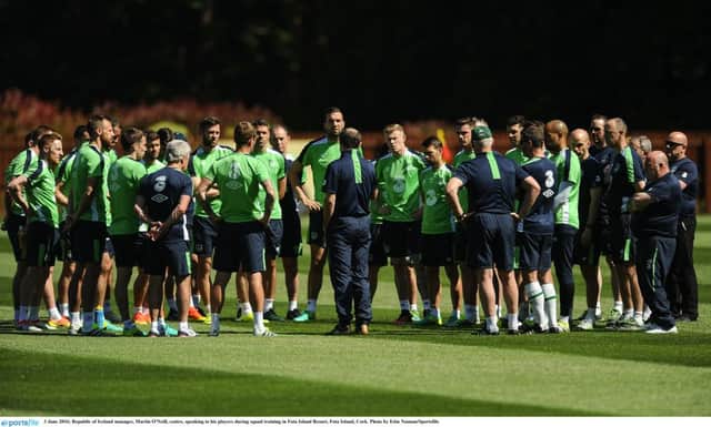 Republic of Ireland manager, Martin O'Neill, centre, speaking to his players during squad training.