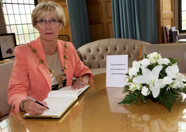 The Mayor of Derry & Strabane Hilary McClintock opening the Book of Condolence at the Guildhall, (Photo - Tom Heaney, nwpresspics)