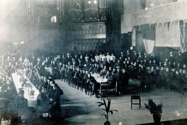 The 120 survivors of the bullion ship 'Laurentic' were photographed at Derry's Guildhall in January 1917. They were each given a shilling and a packet of cigarettes.