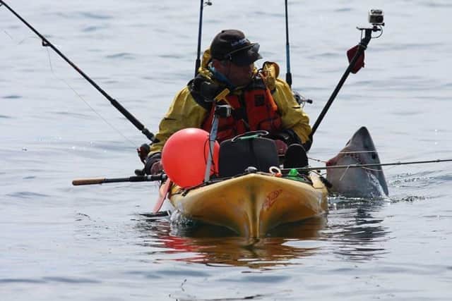 Kayak angler Graham Smith from Moville with the Porbeagle Shark. (Picture by Martin Moloney)