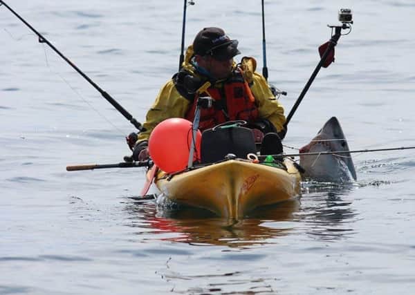 Kayak angler Graham Smith from Moville with the Porbeagle Shark. (Picture by Martin Moloney)