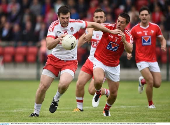 18 June 2016; Mark Lynch of Derry in action against Padraig Rath of Louth during the GAA Football All-Ireland Senior Championship Qualifier Round 1A match between Derry and Louth at Owenbeg Centre of Excellence in Dungiven, Derry. Photo by Oliver McVeigh/Sportsfile