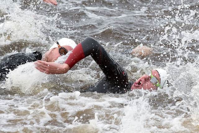 A triathlete powers through the water of the River Foyle during the Firmus Energy City of Derry Triathlon on Sunday morning. Picture Martin McKeown. Inpresspics.com. 19.06.16