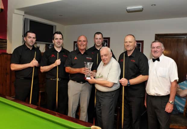 John Clifford presenting the North West Snooker Knockout Cup to Trays A team captain Alan Healy after they defeated Glendermott CC A in the final at Tracys bar on Tuesday evening last. Included in the picture are Gavin Gallagher, Anthony McGill, Emmett Casson, Gerald McCloskey and referee Joe Sims. DER2416GS030