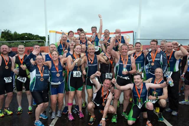 Member of the North West Triathlon Club celebrate after completing the Firmus Energy City of Derry Triathlon on Sunday morning. Picture Martin McKeown.