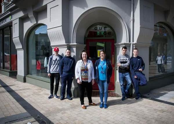 ONE STOP SHOP. . . .Clare Maguire, Co-Ordinator and Danielle Doherty, staff member pictured outside the One Stop Shop on Friday with some of the young people who use the premises.  DER2416MC035