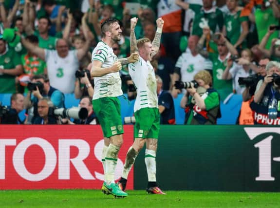 Derry's Shane Duffy and James McClean celebrate at the final whistle on Wednesday.
(INPHO/James Crombie)