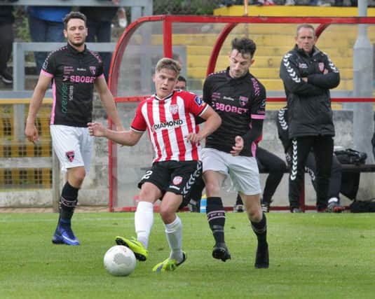 Derry City's Joshua Daniels with Conor O'Keefe of Wexford Youth's at Brandywell.
