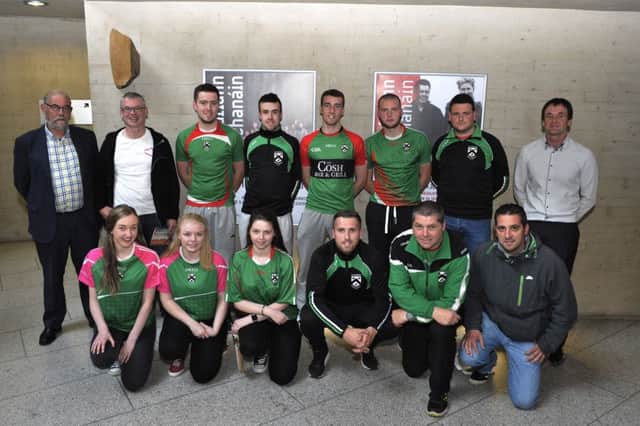 Brian Smith Derry GAA County Chairman (back left) and Joe Brolly pictured with members of Doire Trasna GAC at the launch of Live Life Lisa Orsi Foundation in An Culturlann on Wednesday evening last. DER2616GS035