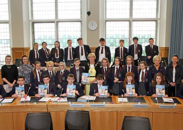 The Mayor  Alderman Hilary McClintock, in the council chambers  with third year pupils from Oakgrove Integrated College, at the launch of the Do You Get The Guildhall? youth/schools democracy programme.  2616-4035MT.