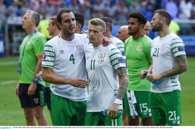 John O'Shea consoles James McClean after the Republic of Ireland's defeat in the UEFA Euro 2016 Round of 16 match against France at Stade des Lumieres in Lyon.