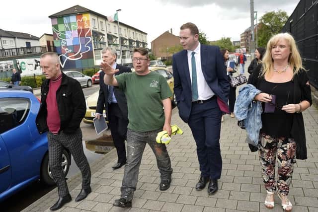 Sinn Fein MLA and Transport Minister, Chris Hazzard, (second from right) pictured during a recent visit to the Bogside.