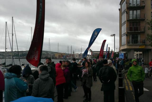 Crowds gathering for the arrival of the Clipper boats.