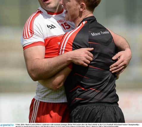 Mark Lynch of Derry celebrates with assistant manager Brian McGuckin after the final whistle in the GAA Football All-Ireland Senior Championship - Round 2A match between Derry and Meath at Derry GAA Centre of Excellence in Owenbeg, Derry. Photo by Oliver McVeigh/Sportsfile