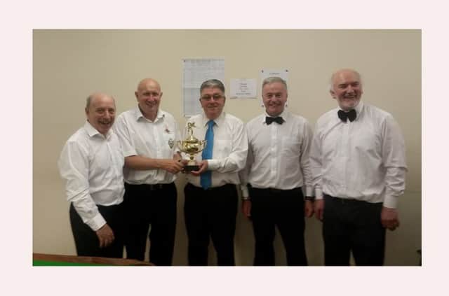 Dan Shiels (deputising for Ray Barrow) and Sean Ferry Recieving the winners trophy from Eddie Gallagher Chairperson Creggan Older Peoples Snooker Club  With the beaten finalist Enda Mc Menamin & Neil Gallagher Gallagher looking on.