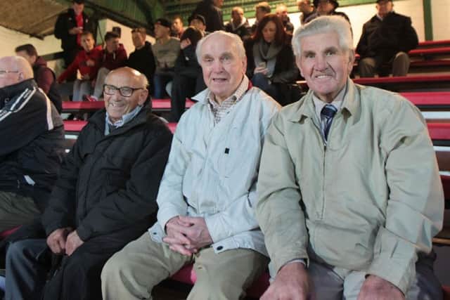 Former Derry City players, Arthur (Mousey) Brady (Belfast), Dan McCaffrey (Omagh) and Willie Curran (Derry) watching Derry City's match against St. Patrick's Athletic in the Brandywell in 2014. (Photograph: MARGARET McLAUGHLIN)