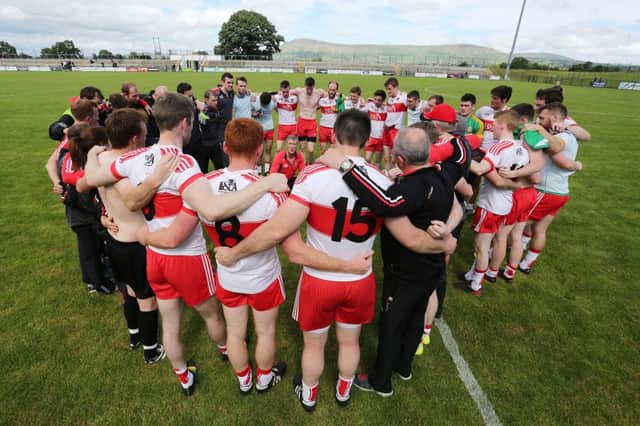 Derry manager Damian Barton speaks to his players at the end of the game against Meath on Saturday.

 (Photo Lorcan Doherty / Presseye.com)