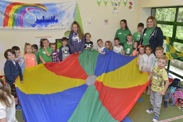 Children and group leaders playing the parachute game at the Derry Search Youth Group Fun Festival in Iona Business Park on Tuesday last. DER2816GS010