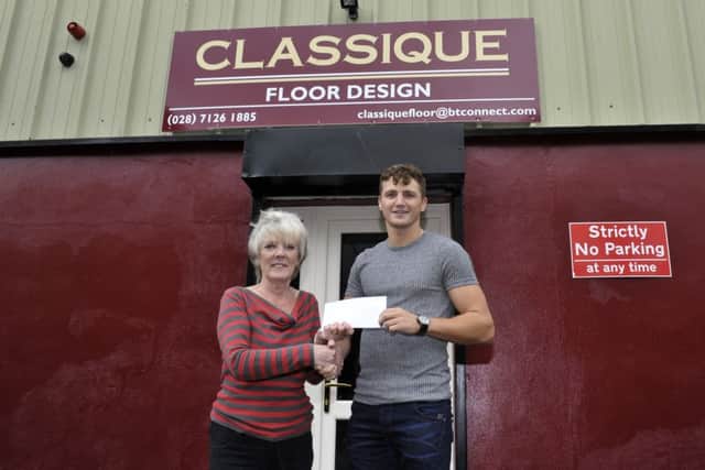 Jean OCarroll from Classique  Floor design presenting Commonwealth Games Medallist  and professional boxer Cononr Coyle with a sponsorship cheque.  DER2816GS30