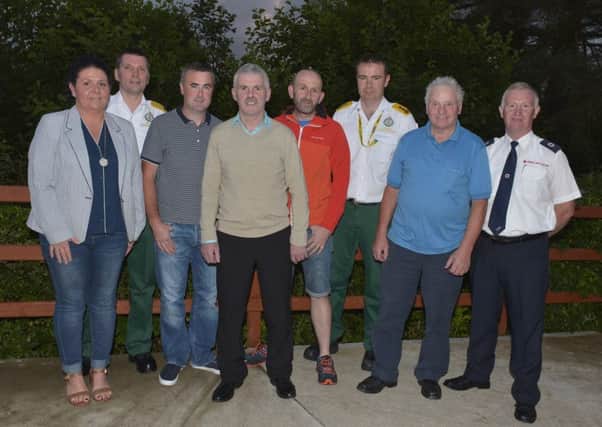 Brendan Duffy (fourth from right) pictured outside the Sliabh Sneacht Centre Drumfries on Wednesday night last with the people who help him when he had a cardiac arrest.  From left, Tina Stewart, Paul Duffy, Charlie McDaid, Michael McDaid, JJ McGowan, Paddy ODonnell and Paul McLaughlin. DER2816GS035