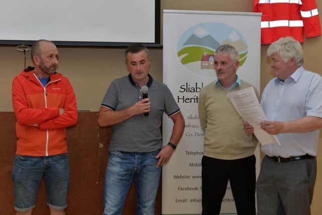Michael McDaid (left) and Charlie McDaid reflect on the moments, at a public meeting in the Sliabh Sneacht Centre Drunfries on Wednesday evening last, of how they helped in the emergency when Brendan Duffy (second from right) suffered a cardiac arrest.  Also in the picture is Colr Nicholas Crossan. DER2816GS036