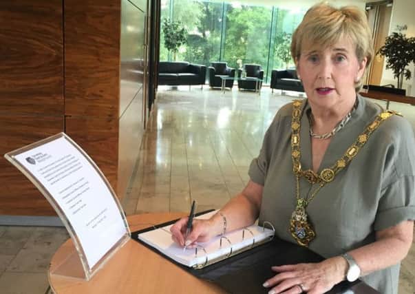 Causeway Coast & Glens Borough Mayor, Maura Hickey signs a book of condolence for victims of the Nice attack.