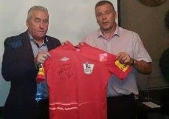 Ken with Mark Halsey, ex-English Premier League referee handing over one of his jerseys at a function in Derry last November.