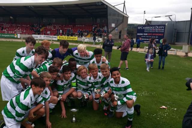 Celtic Under-14s celebrate winning the Foyle Cup at Brandywell.
