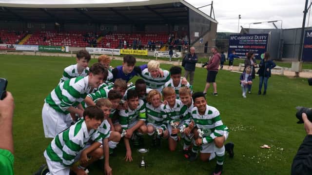 Celtic Under-14s celebrate winning the Foyle Cup at Brandywell.
