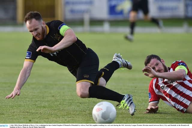 Ryan McBride of Derry City is adjudged to have fouled Stephen O'Donnell of Dundalk by referee Paul McLaughlin resulting in a red card.