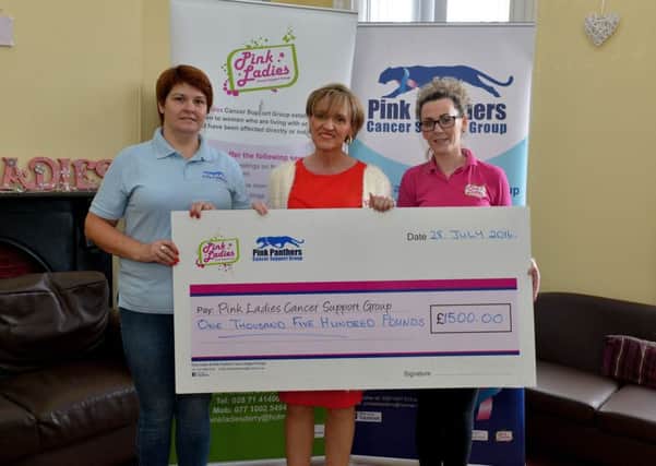 Martina Anderson MEP presenting a cheque for £1500 to Maureen Collins (left) and Michelle McLaren from the Pink Lades Cancer Charity at Bayview Terrace yesterday morning. The donation comes from Ian Paisley Jr as part of a settlement reached in defamation proceedings brought by the Sinn Fein MEP. DER3016GS34