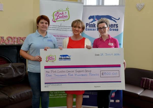 Martina Anderson MEP presenting a cheque for Â£1500 to Maureen Collins (left) and Michelle McLaren from the Pink Lades Cancer Charity at Bayview Terrace yesterday morning. The donation comes from Ian Paisley Jr as part of a settlement reached in defamation proceedings brought by the Sinn Fein MEP. DER3016GS34
