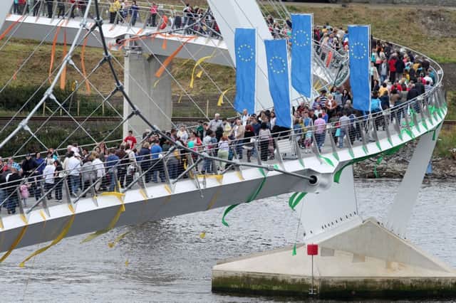 People crossing the European Union funded Peace Bridge on the day it  was opened by the EU Commissioner for Regional Policy Johannes Hahn back in June 2011.  Picture: Michael Cooper