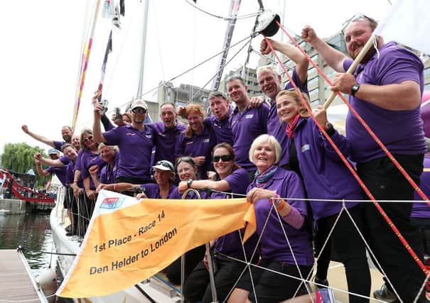 The crew of the Derry-Londonderry-Doire Clipper boat celebrate after finishing first in the final race from Den Helder to London.