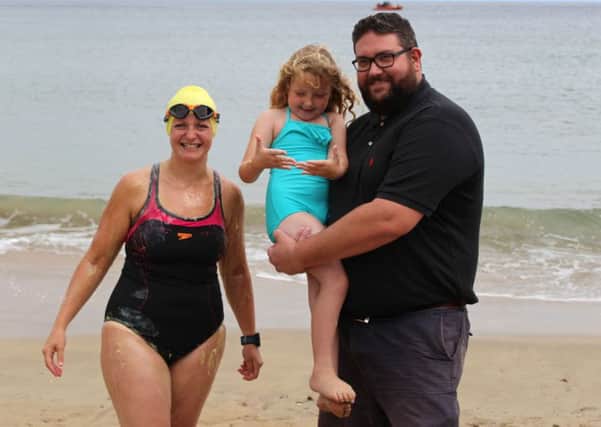 Handout photo of Heather Clatworthy with husband Ian and daughter Lily before she began her 13 mile swim from Stroove in Co Donegal to Portstewart in Northern Ireland