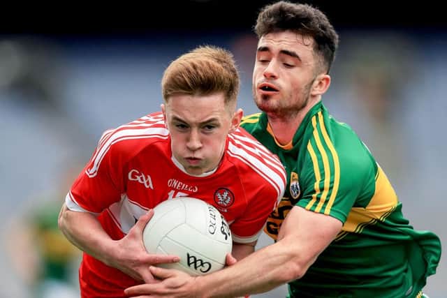 Derry's Eoghan Bradley with David Naughton of Kerry during the All Ireland Minor quarter-final at Croke Park.