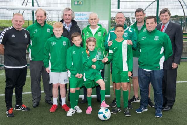 Members of Foyle Harps Youth Football Club and coaches who received the McDonald's IFA Regional Accredited Club of the Year Award in recognition of the club's success.