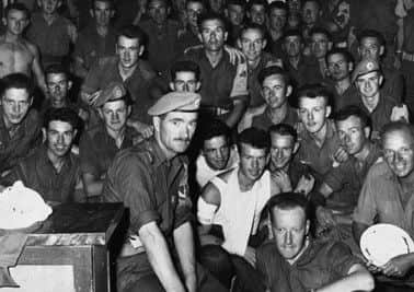 Commandant Pat Quinlan pictured with his men in the aftermath of the Siege of Jadotville.
