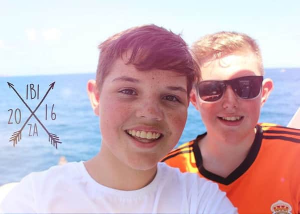 Conor Rabbett (14) from Culmore with a friend he met on holiday in Ibiza.
