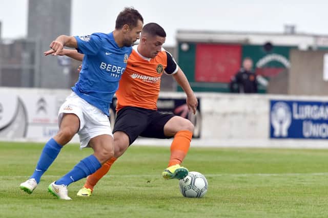 .
Glenavon's Declan O'Brien
and Carrick's Seanna Foster
