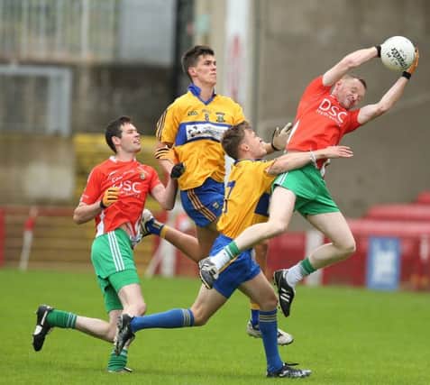 Limavady's Eoghan Rogers leaps in delight after Sheagh McLaughlin's injury time goal gave the Wolfhounds a 1-09 to 0-10 Junior Championship win over Drum in Celtic Park. (Photo: Dessie Loughery)