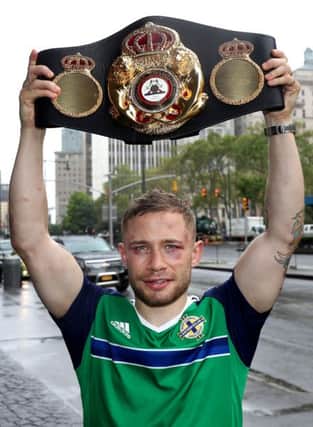 Carl Frampton pictured with the WBA featherweight belt the morning after defeating Leo Santa Cruz.
