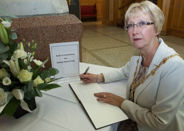 Mayor Hilary McClintock signing the Book of Condolence. (Photo - Tom Heaney, nwpresspics)