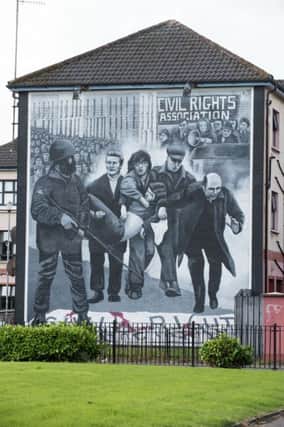 A mural in the Bogside area of Derry depicting Bishop Daly waving the white handkerchief . (Picture By: Pacemaker.)