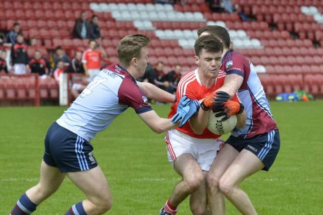 Sean Dolans Caolan McCosker is challenged by Glacks Luke McLaughlin and Ciaran O'Brien during their game in Celtic Park on Saturday afternoon last. DER3116GS087