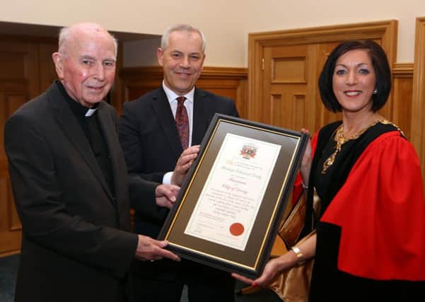 Former Mayor of Derry Brenda Stevenson and John Kelpie, Chief Executive, Derry City and Strabane District Council presenting the Freedom of the City to Most Rev. Dr. Edward Daly back in March 2015. (Photo Lorcan Doherty Photography)