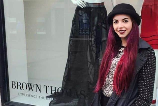 Limavady fashion designer, Kyree Forrest with her designs in the window of Brown Thomas in Galway.